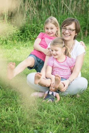 family in park posing and having fun